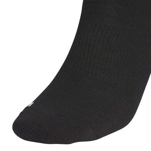 Black crew sock toe and foot, knit texture with small white logo