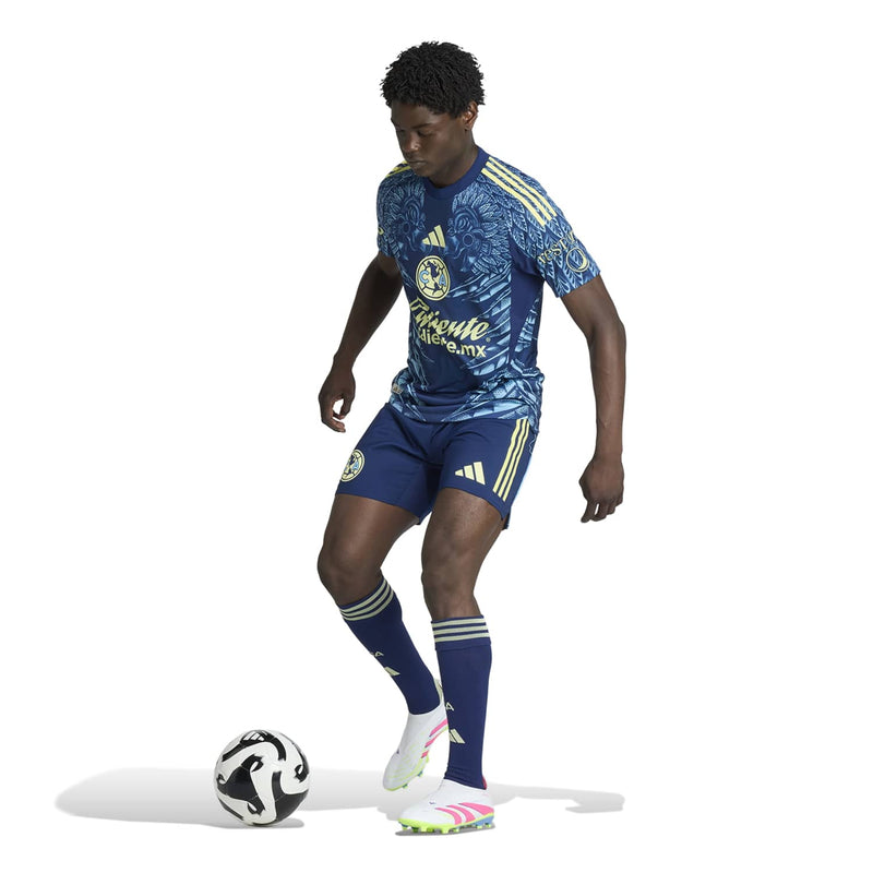 Men's Club America away jersey side view, navy with gold sleeve stripes and Caliente print.