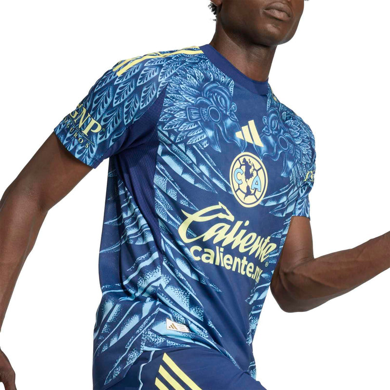 Men's Club America away jersey close-up, navy with C*A crest and Caliente.mx sponsor.