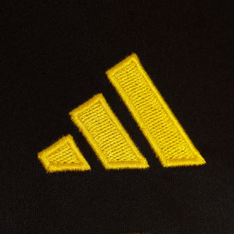 Adidas three-stripe logo on dark jersey