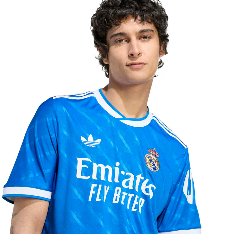 Blue Real Madrid third jersey close-up with Emirates Fly Better and crest