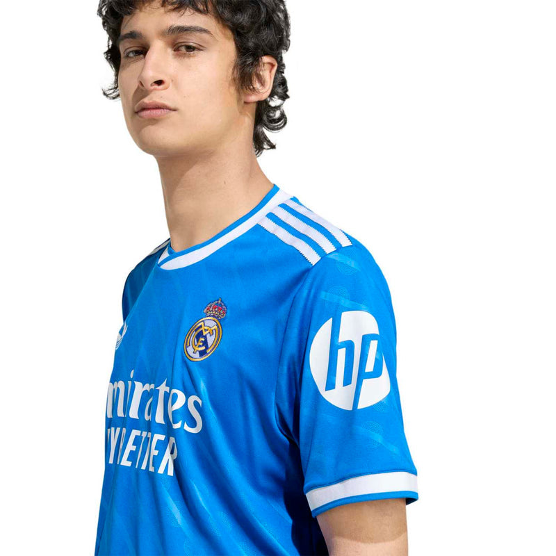 Blue Real Madrid third jersey sleeve with HP logo and white shoulder stripes