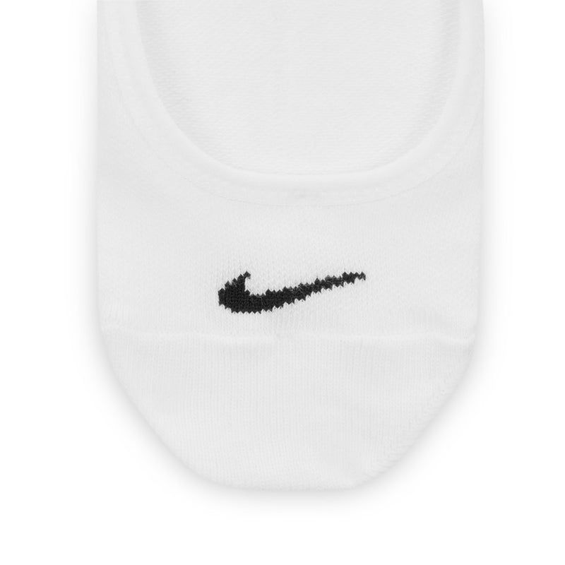 White footie sock close-up, black Nike swoosh on front toe