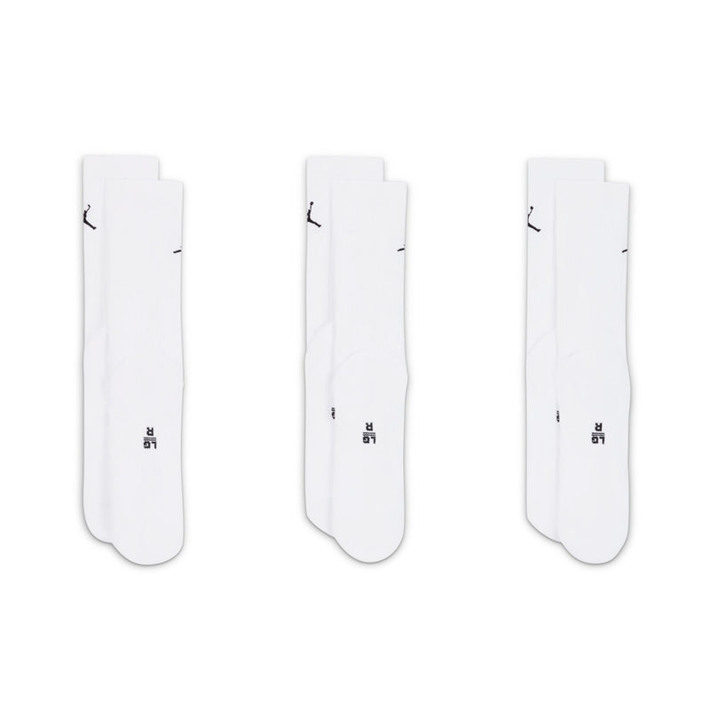 Three-pack white crew socks showing black Jumpman logos and ribbed cuffs