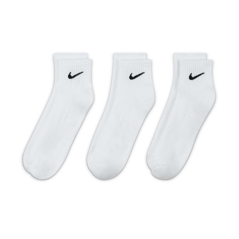 Three-pack white crew socks with black Nike swooshes, cushioned