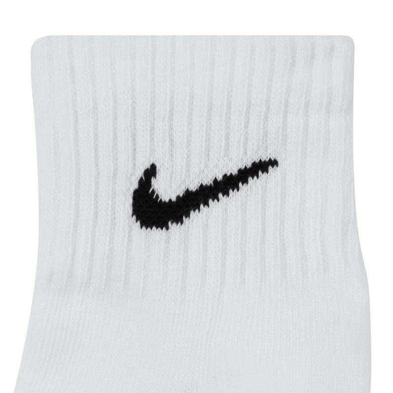 White quarter sock close-up with black Nike swoosh logo