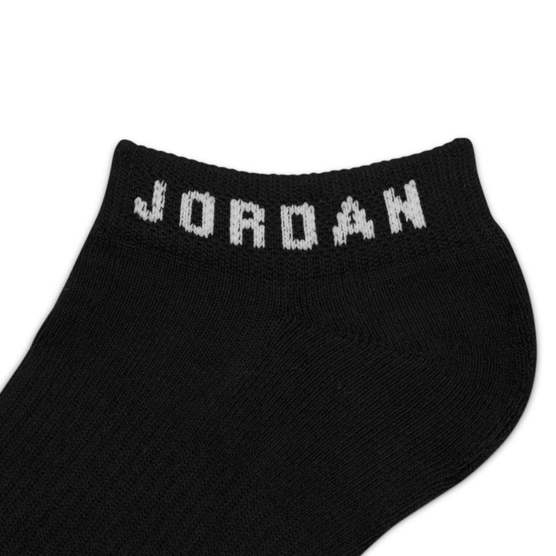 No-show sock close-up, black knit with white Jordan lettering