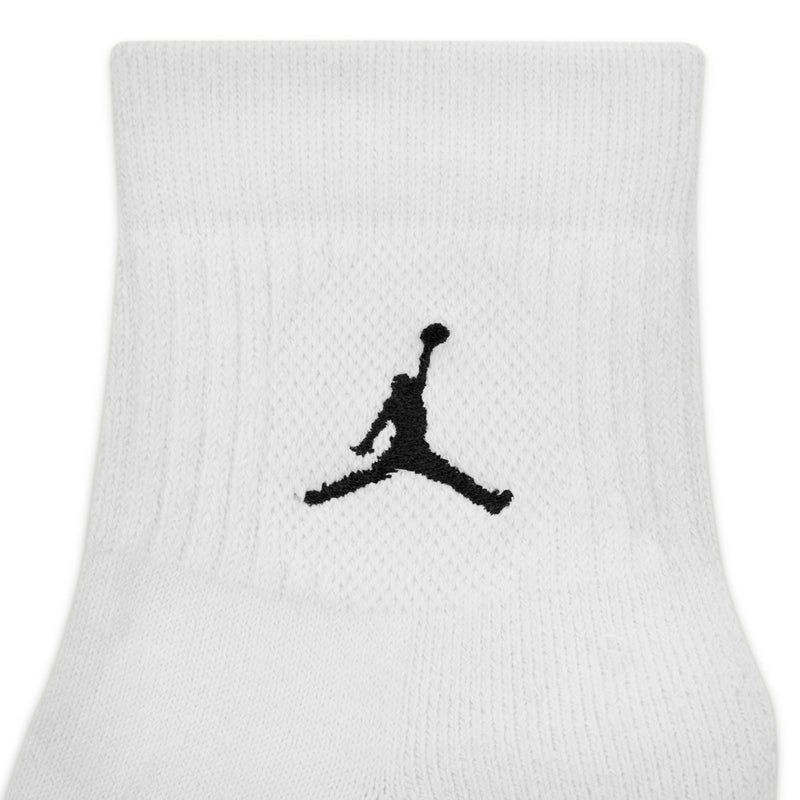 White unisex quarter sock with black Jumpman logo on cuff, close-up