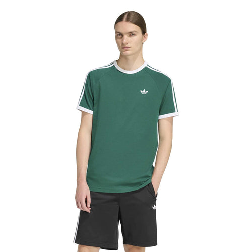 Men's green tee with white crew neck trim, small chest emblem, and three stripe shoulders