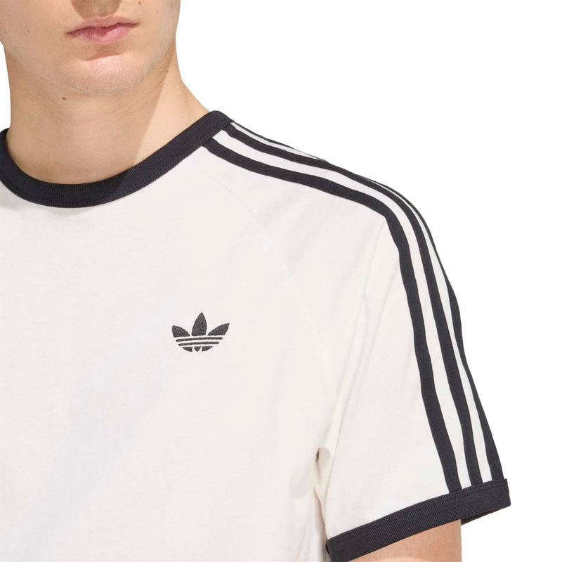 Close-up of white adidas 3-stripe T-shirt neckline with black collar and sleeve stripes