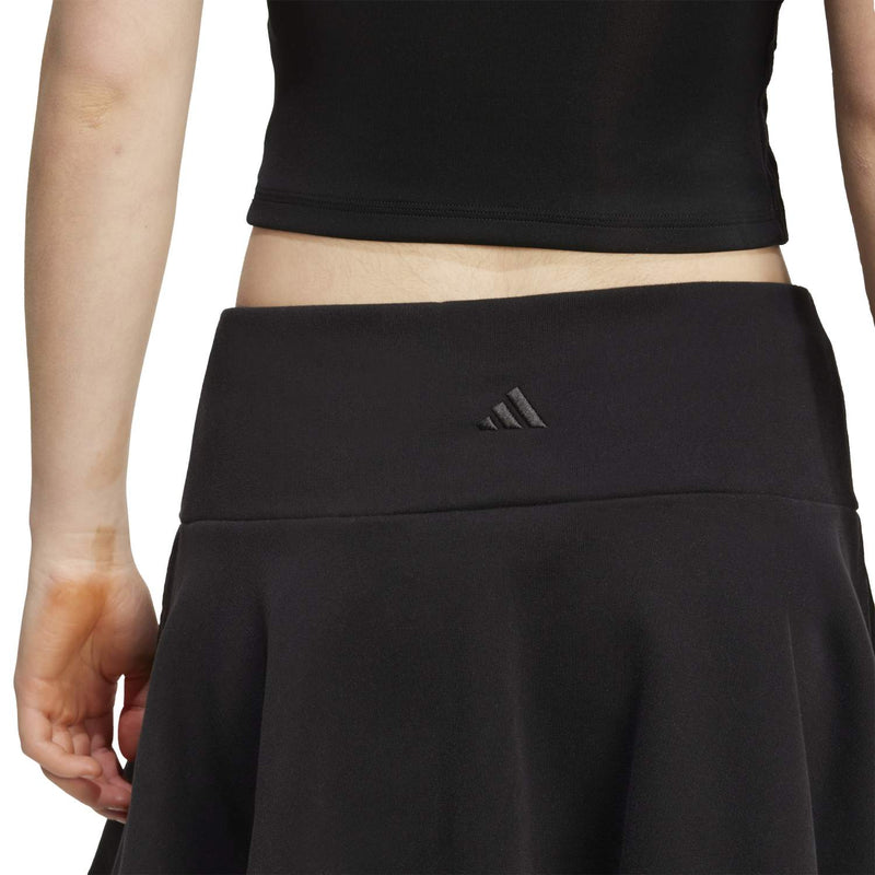 Women's black French terry skirt with small adidas logo on waistband, A-line flare