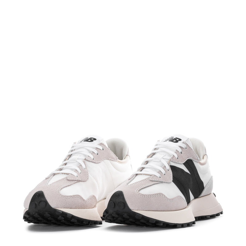 Pair of women's sneakers in white with blush panels and black logo