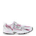 Kids running shoes in white with pink accents, mesh panels, lace-up closure