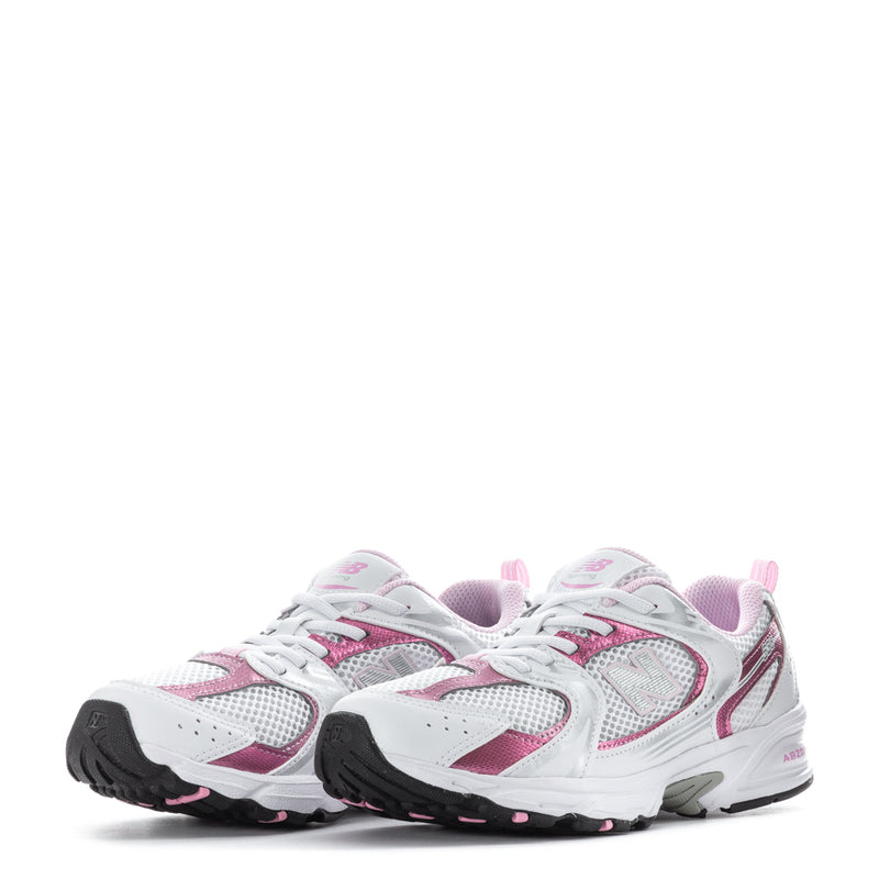 Kids running shoes pair, white with pink details, lace-up mesh upper and cushioned sole