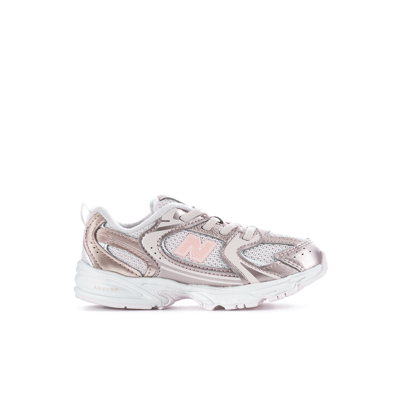 Toddler sneaker in light pink with lace-up front and white sole