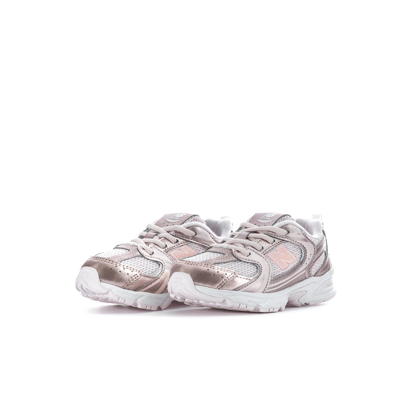 Toddler sneaker pair in light pink with metallic panels, lace-up and white sole