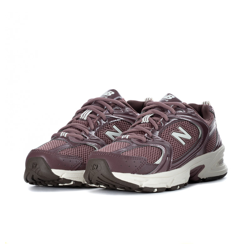 Pair of women’s maroon New Balance 530 wide running shoes, lace-up, white midsole
