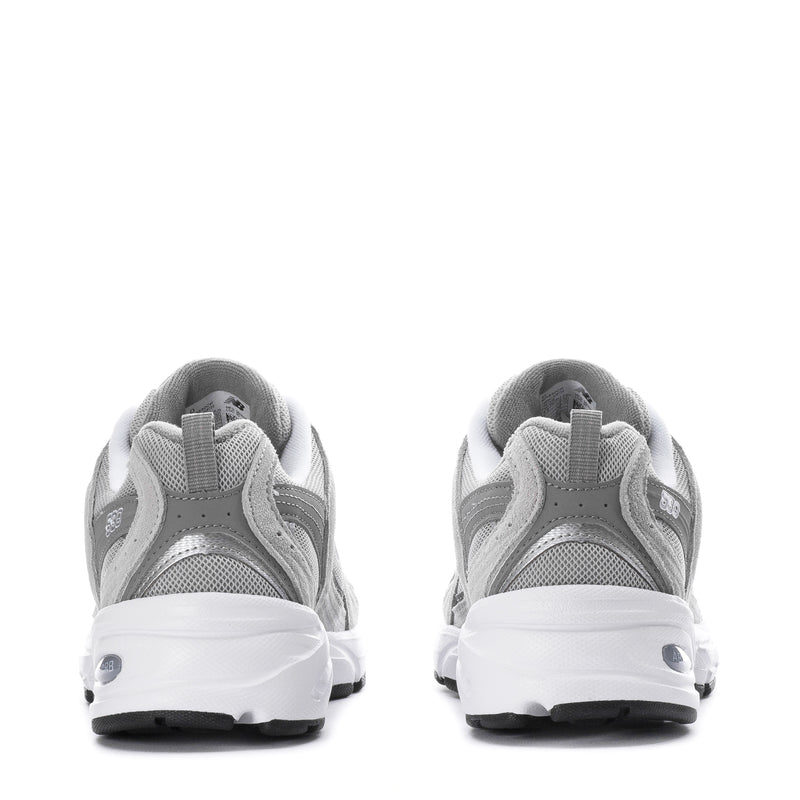 Women's wide gray New Balance 530 sneakers, rear view with white midsoles