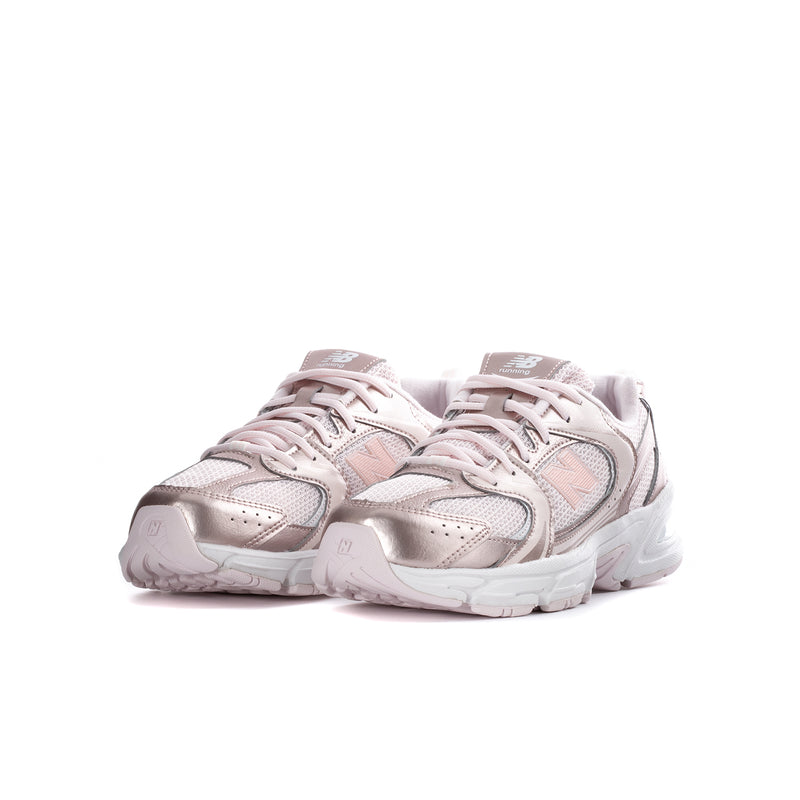 Youth lace-up running sneaker with light pink upper, metallic accents, and chunky white midsole.