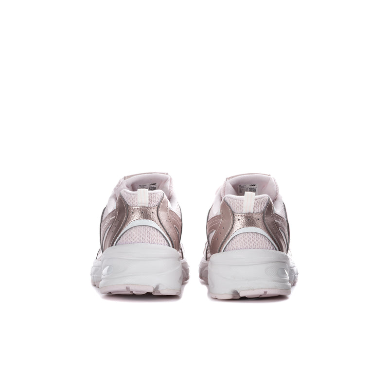 Youth sneakers heel view in light pink with cushioned back and white sole tread.