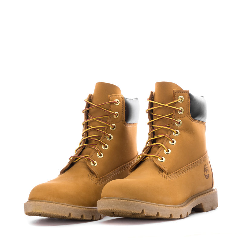 Pair of wheat lace-up waterproof boots with black inner panels and chunky tread soles