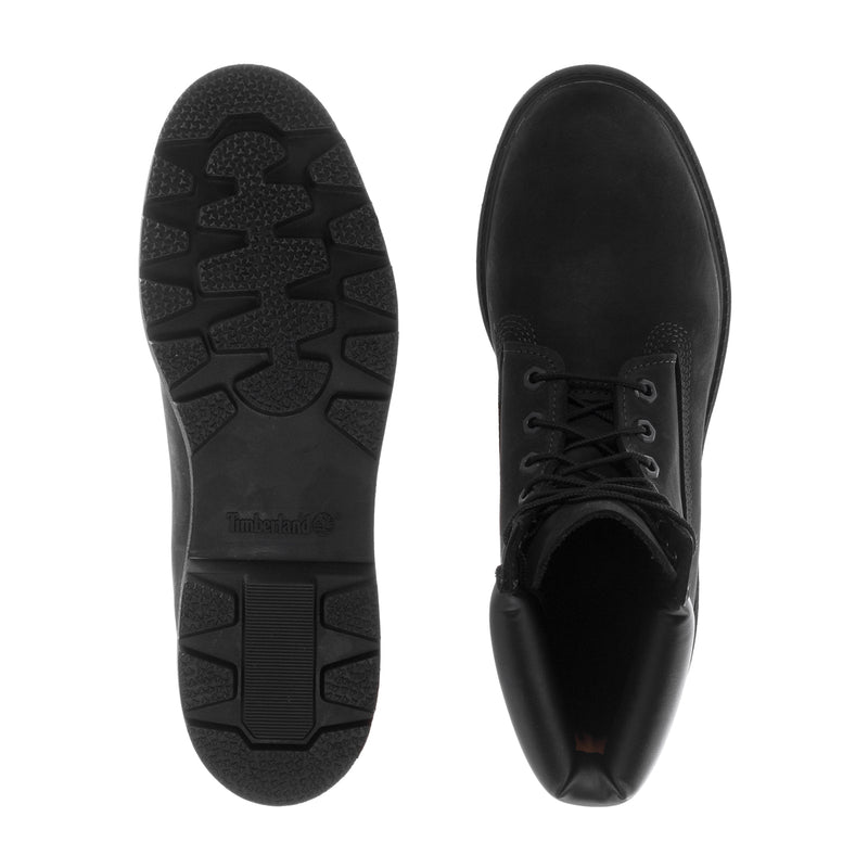 Men's black boot soles and inside view, showing tread lugs and lace-up opening