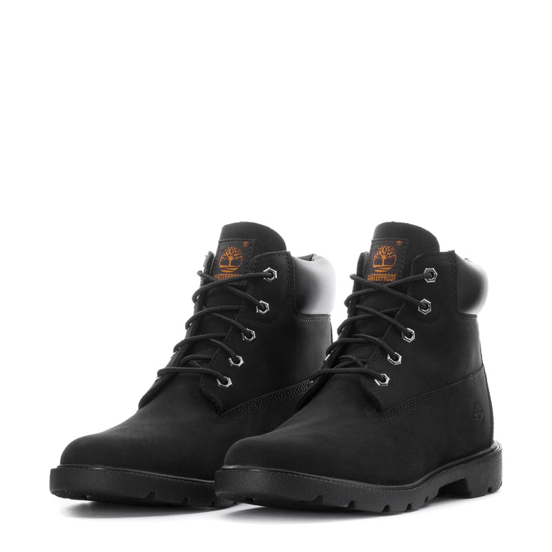 Youth black lace-up boots with orange logo patch and chunky sole