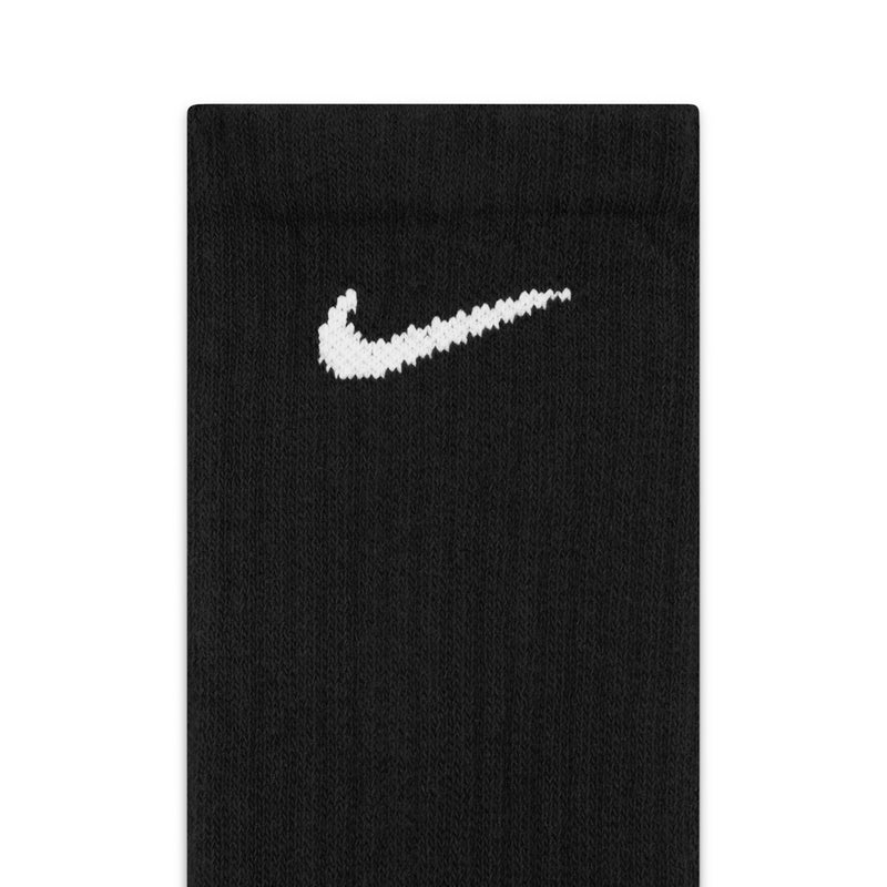 Black crew socks, white Nike swoosh logo, cushioned 6-pack