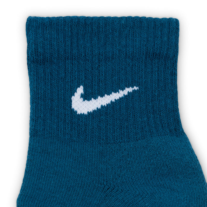 Blue cushioned quarter socks with white Nike swoosh logo