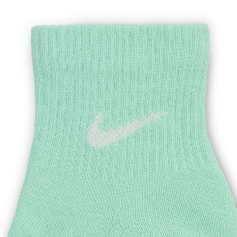 Mint green quarter crew sock close-up with white Nike swoosh logo