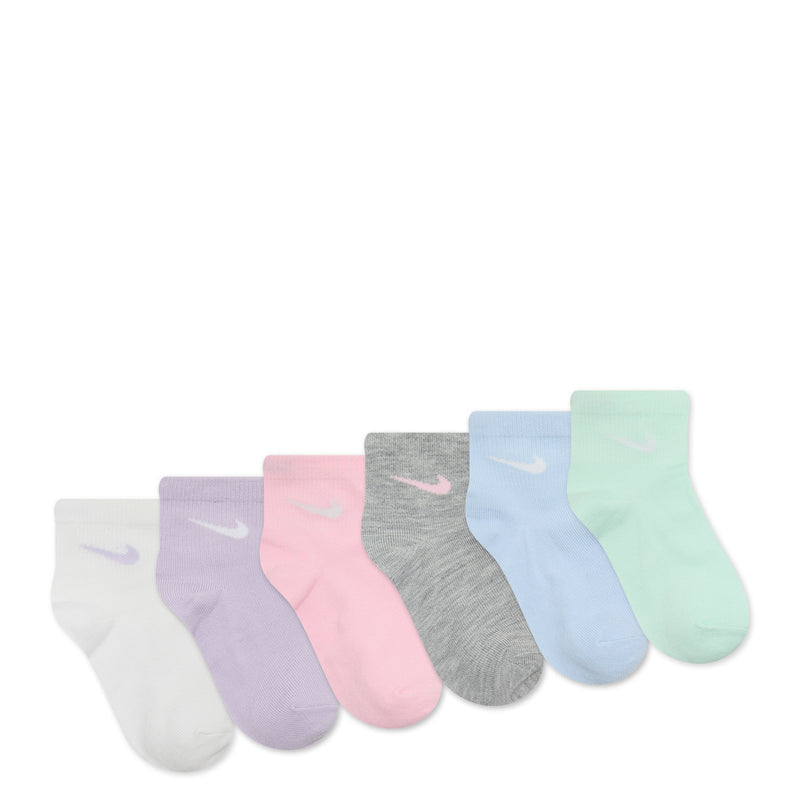 6-pack x-small quarter socks laid out, pastel tones with metallic swoosh logos
