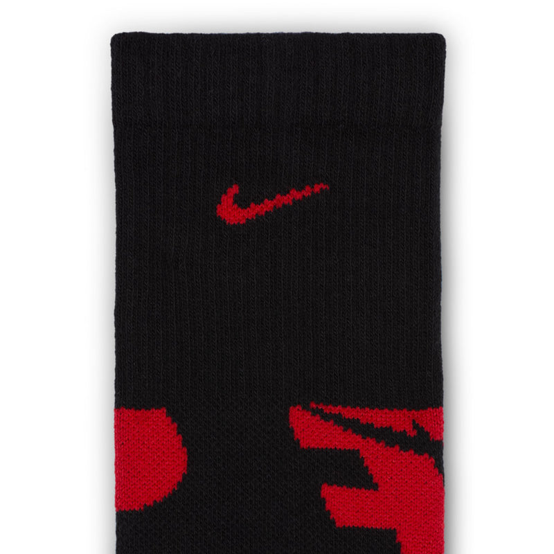 Black youth crew sock with red swoosh logo detail and contrasting red accents.