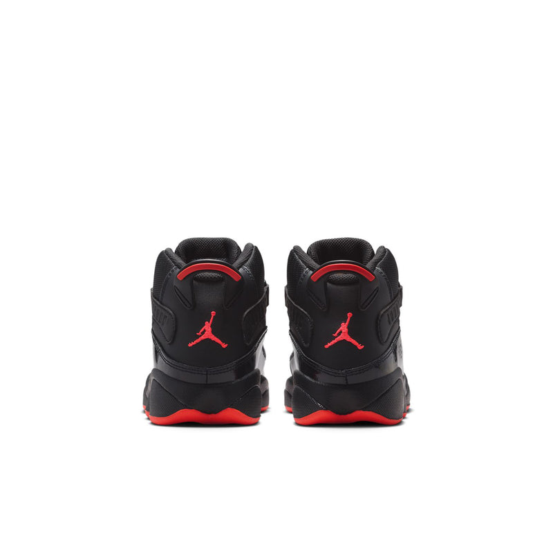 Kids black high-top sneakers with red Jumpman on heel and red outsole edge