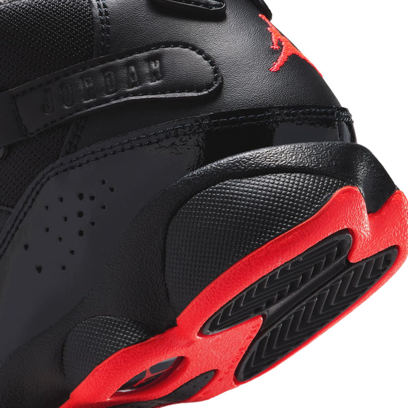 Kids black high-top sneaker detail, red Jumpman and textured sole, close-up