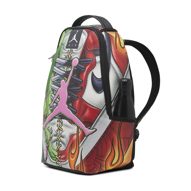 Sneaker graphic backpack side view, black shoulder strap and white/red/green artwork