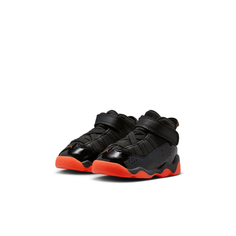 Pair of black toddler high-top sneakers with double hook-and-loop straps, red soles