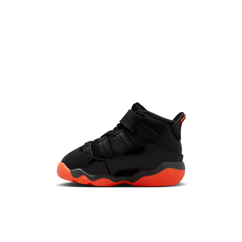 Black toddler high-top sneakers in side view with red outsole and hook-and-loop strap