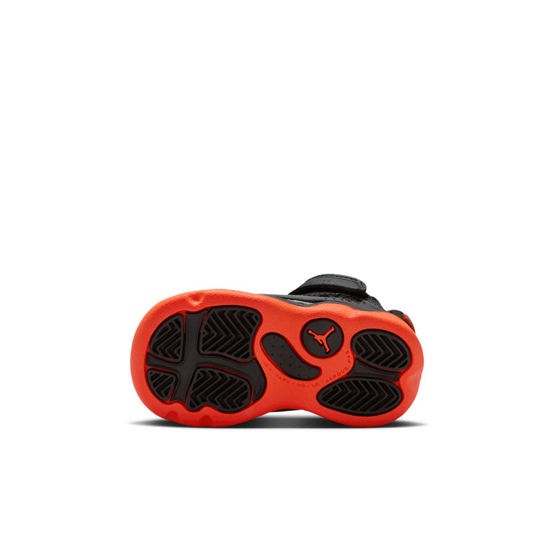 Black toddler sneakers outsole view with red traction pattern and Jumpman emblem