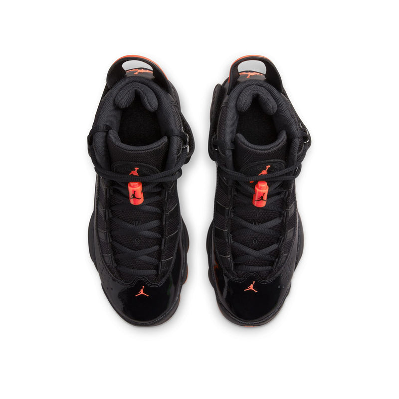 Pair of youth black high-top shoes with red lace details and orange outsole