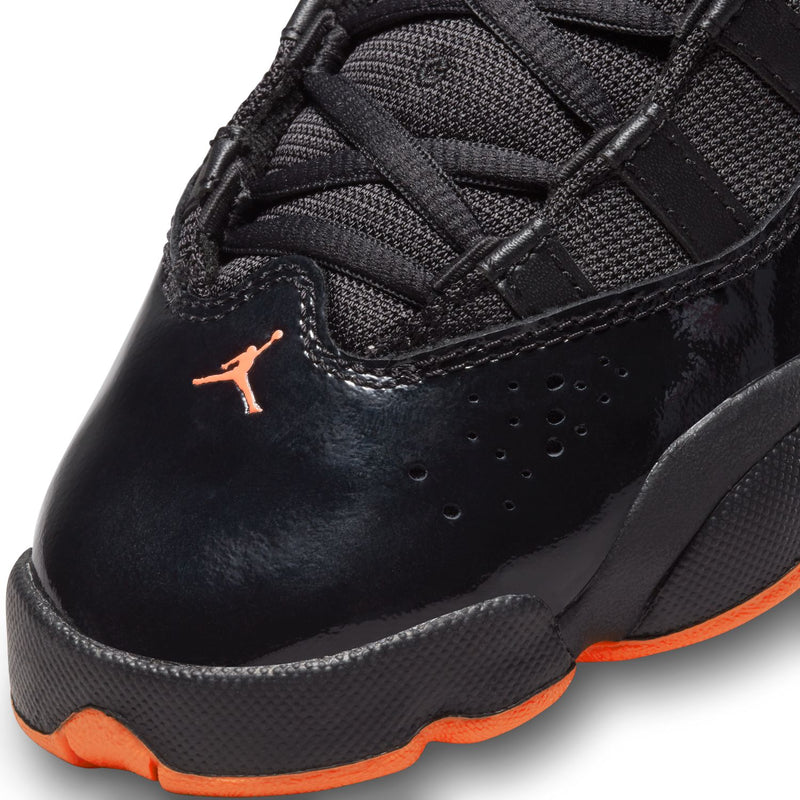 Youth black high-top shoe with textured panels, perforations, and Jumpman logo detail