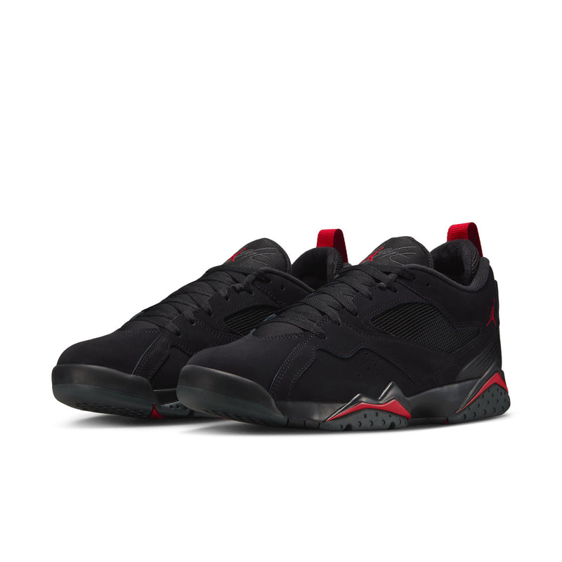 Men's black low-top sneakers with red accents, lace-up closure, and rubber outsole