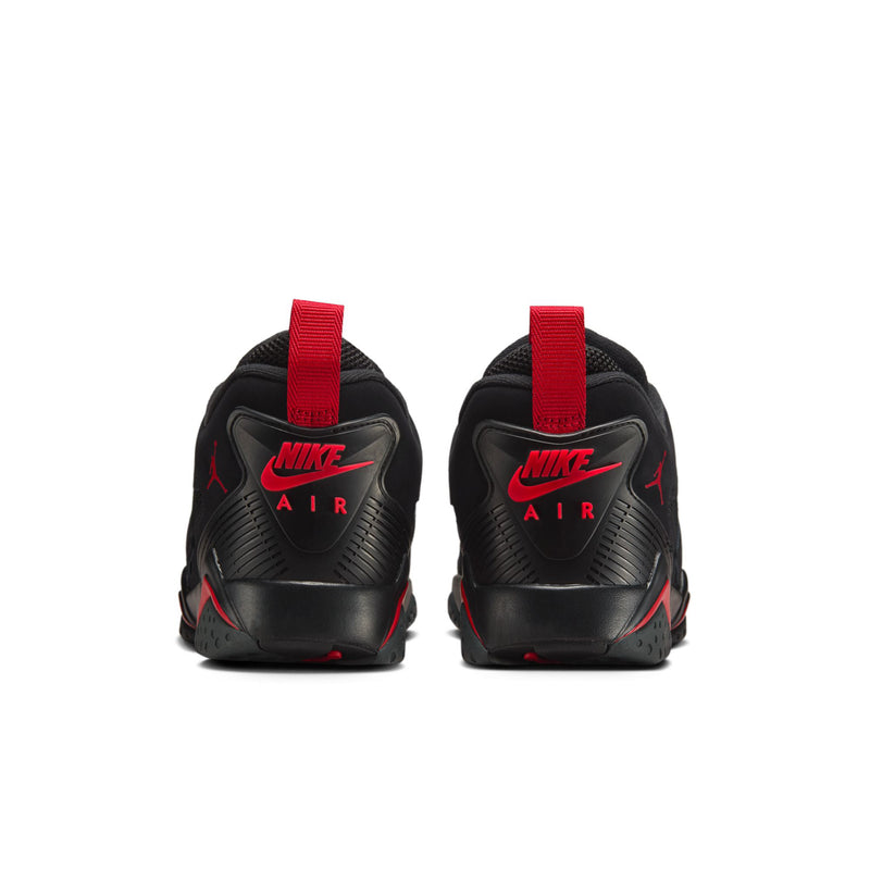 Men's black sneakers with red strap at heel and NIKE AIR text on the back