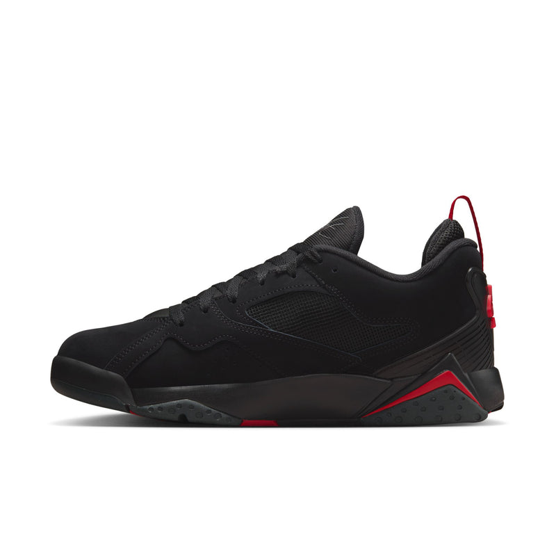 Men's black low-top sneaker with red-lined collar, lace-up front, and rubber sole