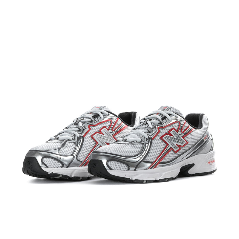 Pair of white, silver and red athletic shoes with black heel accents and red trim