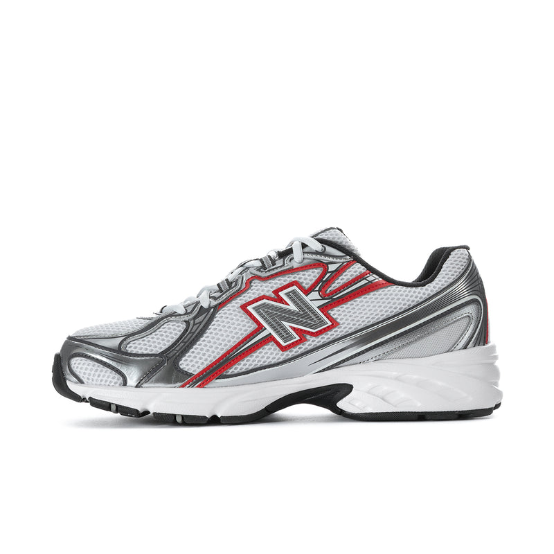 Side view of white, silver and red lace-up athletic shoes with large red N emblem
