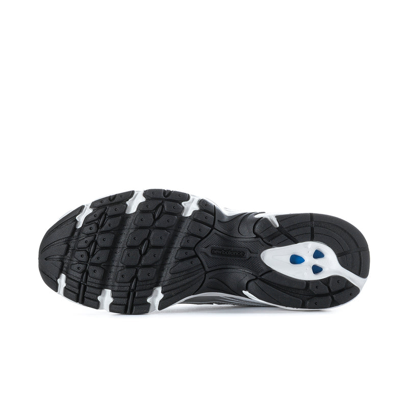 Men's running shoes outsole view with dark tread and white midsole, black heel