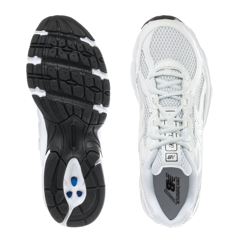 Women's white lace-up sneakers with tread outsole and mesh upper view