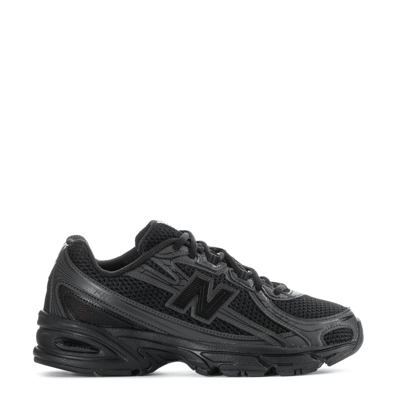 Youth New Balance running sneakers, black with gray overlays and lace-up front