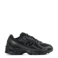 Youth New Balance running sneakers, black with gray overlays and lace-up front