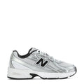 Silver youth running sneaker with black trim, mesh upper, New Balance 'N' logo